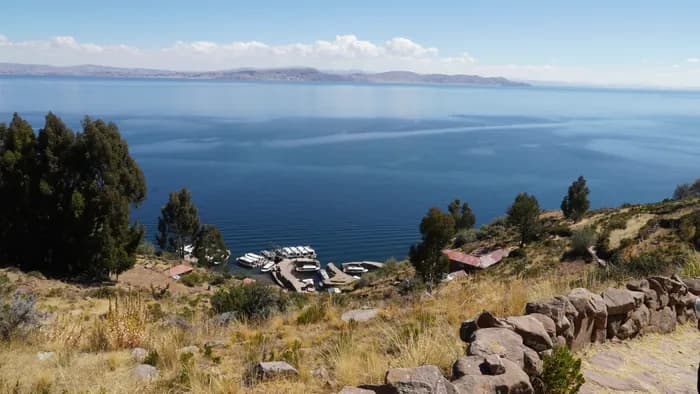 Stone path leading to the island arch with Lake Titicaca behind