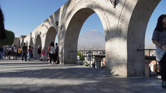 Sillar arches of the Yanahuara viewpoint with El Misti volcano behind
