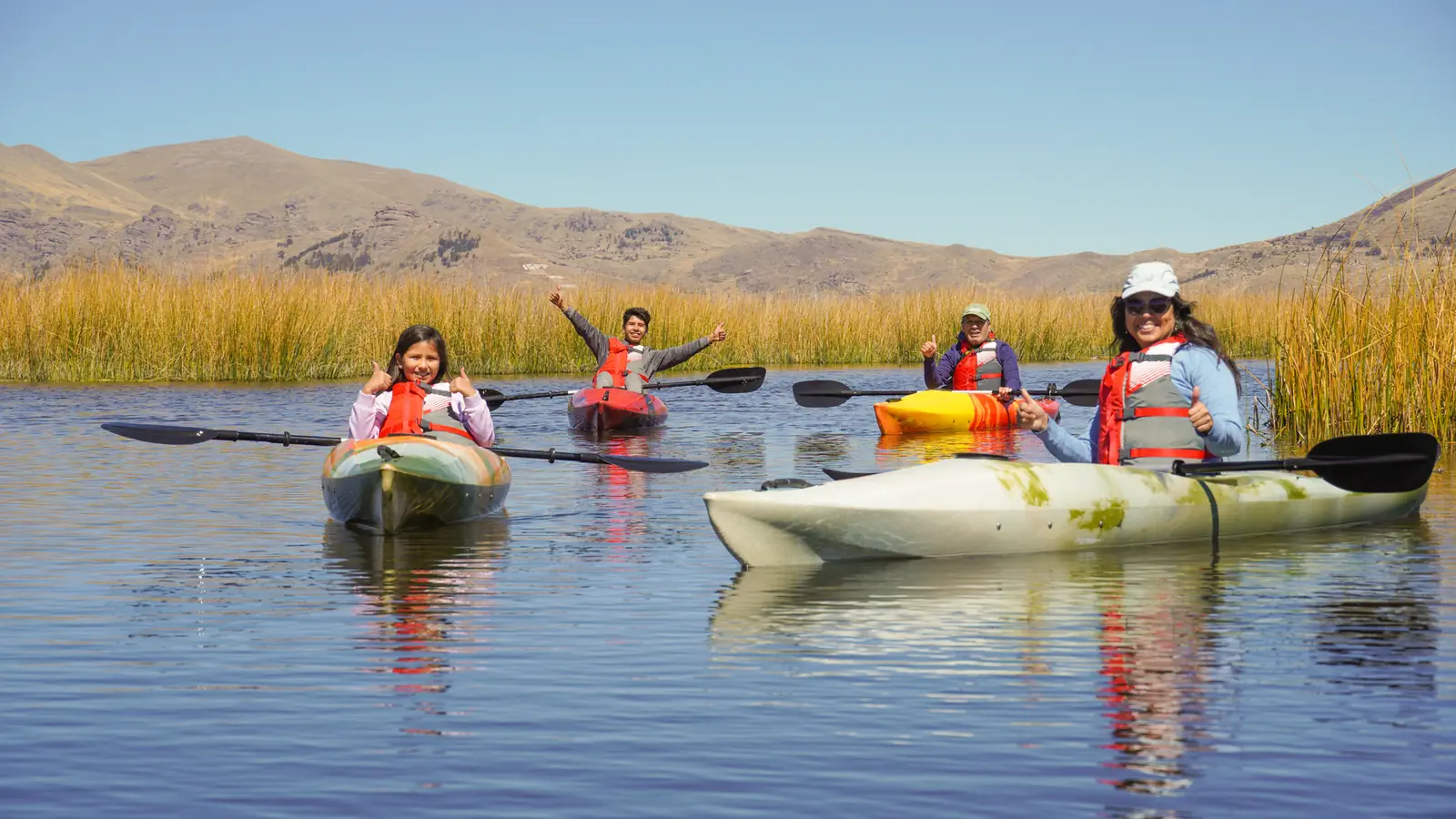 Tandem kayak paddling through the reed beds of Lake Titicaca